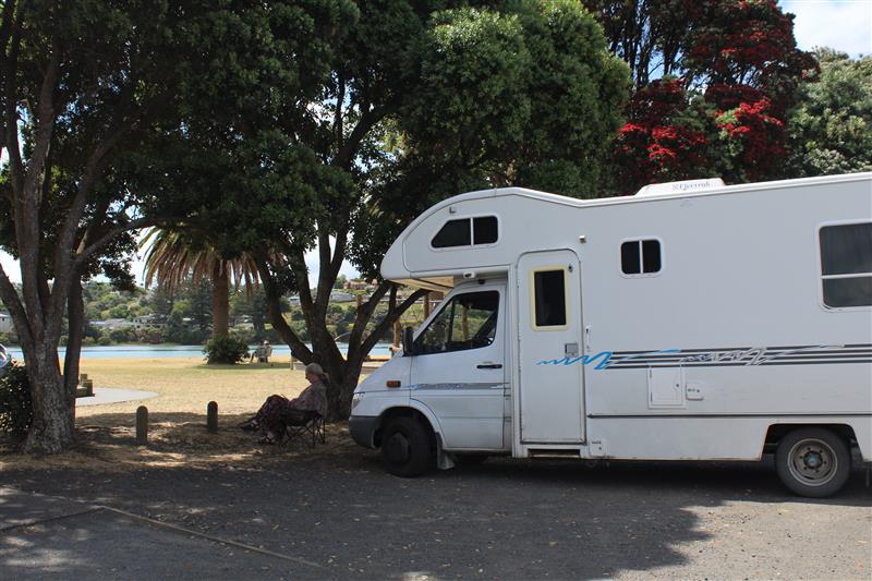 Camper van parked by beach