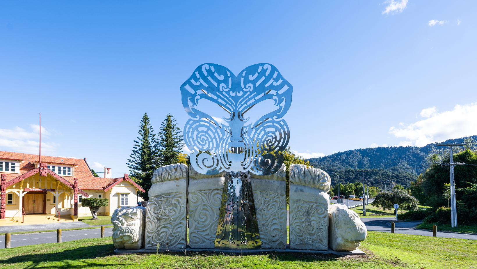 The moko of Kings Pootatau and Tawhiao with Turangawaewae House, Kiingitanga headquarters, in the background. 
